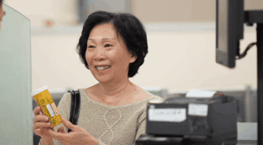 Woman-picking-up-medication-at-pharmacy