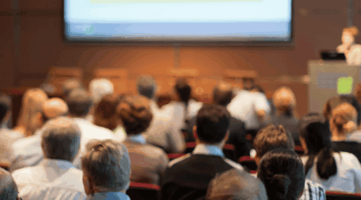 speaker-presenting-crowd